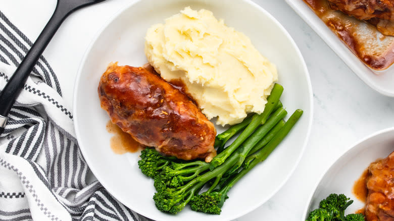 Hunter's chicken on plate with mash potatoes and broccoli
