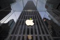 The leaf on the Apple symbol is tinted green at the Apple flagship store on 5th Avenue in New York, in this file picture taken April 22, 2014. REUTERS/Brendan McDermid/Files
