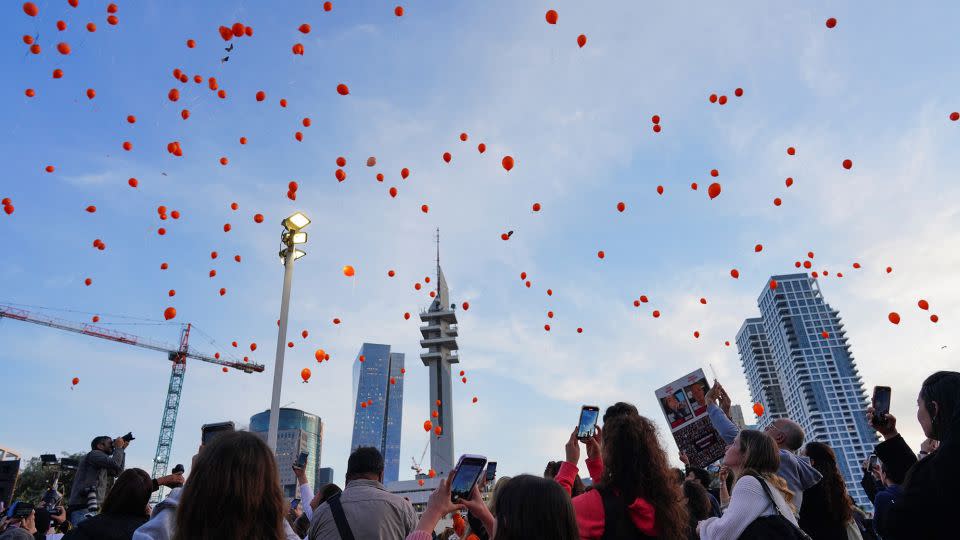 Balloons were released in Tel Aviv to mark the first birthday of Kfir Bibas. - Alexandre Meneghini/Reuters