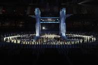 <p>Dancers perform around four totems, which represent the <a href="http://blogs.wsj.com/dailyfix/2010/02/12/winter-olympics-opening-ceremony-diary/" rel="nofollow noopener" target="_blank" data-ylk="slk:four host First Nations;elm:context_link;itc:0;sec:content-canvas" class="link ">four host First Nations</a>.</p>