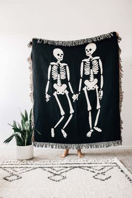 A really rad skeleton throw to use while snuggling up with your scaredy-cat boo during the horror movie marathon you've tricked them into