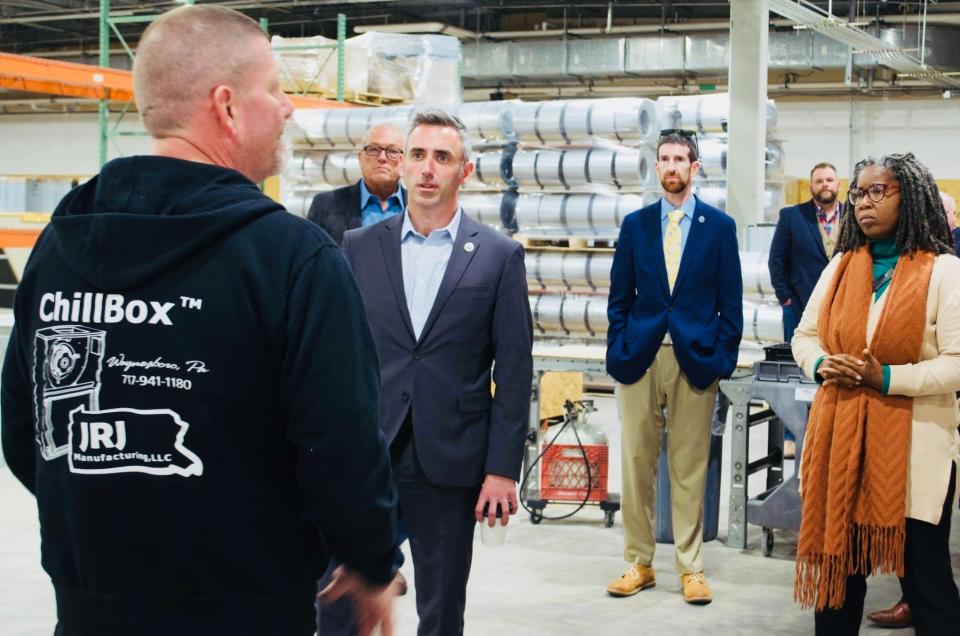 In this file photo circa 2023, Maryland Housing and Community Development Secretary Jake Day hears about operations at JRJ Manufacturing, a heating, ventilation and air conditioning manufacturer that relocated from Waynesboro, Pa., to the former Fort Ritchie post exchange last year. Behind him are, from left, Washington County Commissioner Randy Wagner, Washington County Director of Business and Economic Development Jonathan Horowitz, Richie Revival developer John Krumpotich and Hagerstown Mayor Tekesha Martinez.