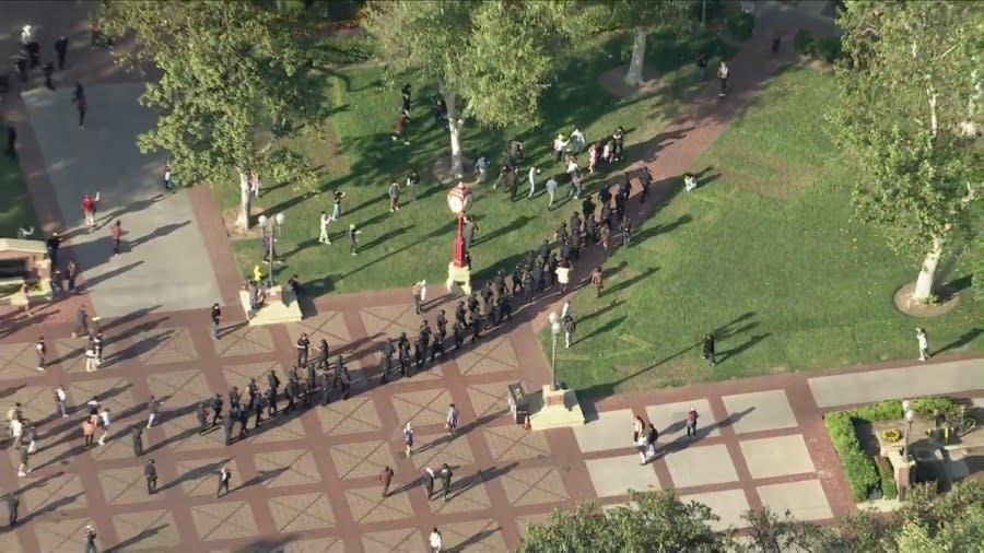 Police in riot gear dispersing pro-Palestinian demonstrators at the University of Southern California on April 24, 2024. (KTLA)