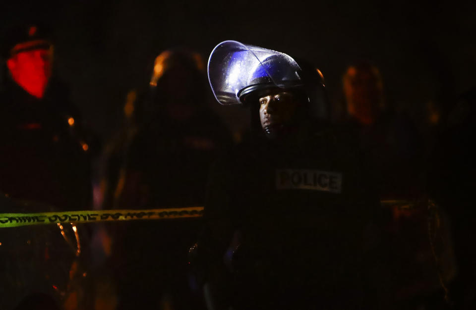 Memphis police maintain a perimeter around the crime scene after protesters took to the streets of the Frayser community in anger against the shooting of a youth by U.S. Marshals earlier in the evening, Wednesday, June 12, 2019, in Memphis, Tenn. Dozens of protesters clashed with law enforcement, throwing stones and tree limbs until authorities broke up the angry crowd with tear gas. (Photo: Mark Weber/Daily Memphian via AP)