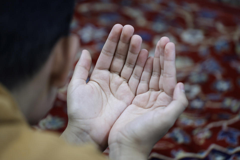 A man prays during Friday prayers, Friday, Oct. 13, 2023, at the Islamic Center of East Lansing in East Lansing, Mich. In Muslim communities across the world, worshippers gathered at mosques for their first Friday prayers since Hamas militants attacked Israel, igniting the ongoing Israel-Hamas war. (AP Photo/Al Goldis)