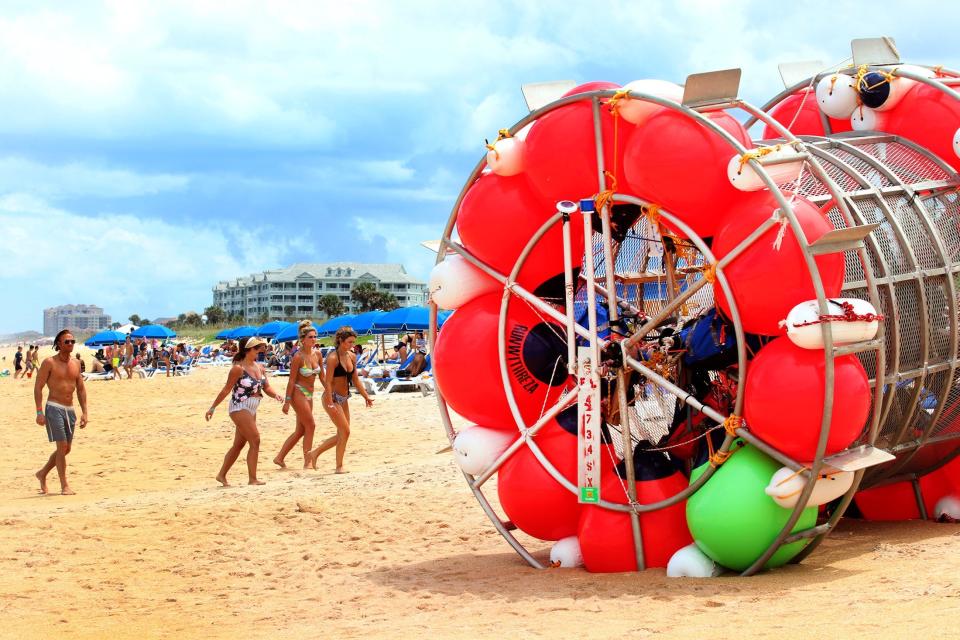 Reza Ray Baluchi faces charges related to an attempt to cross the Atlantic Ocean to London in a makeshift human-sized hamster wheel, shown in this 2021 file photo from an earlier effort to reach New York from St. Augustine, Florida.