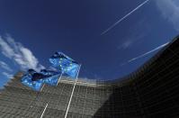 European Union flags flutter outside the European Commission headquarters in Brussels