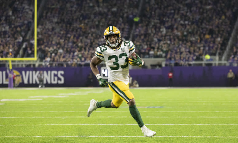 Green Bay Packers running back Aaron Jones running with the football.