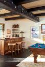 <p>If your home is blessed with exposed beams, why not accentuate their beauty even further by painting them? In this room by <a href="https://www.communedesign.com/" rel="nofollow noopener" target="_blank" data-ylk="slk:Commune Design;elm:context_link;itc:0;sec:content-canvas" class="link ">Commune Design</a>, the beams emit warmth and character, and they're given a whimsical touch with custom painted designs. </p>