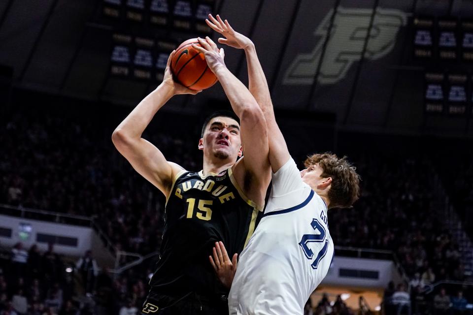 Purdue center Zach Edey shoots over Marquette forward Ben Gold.