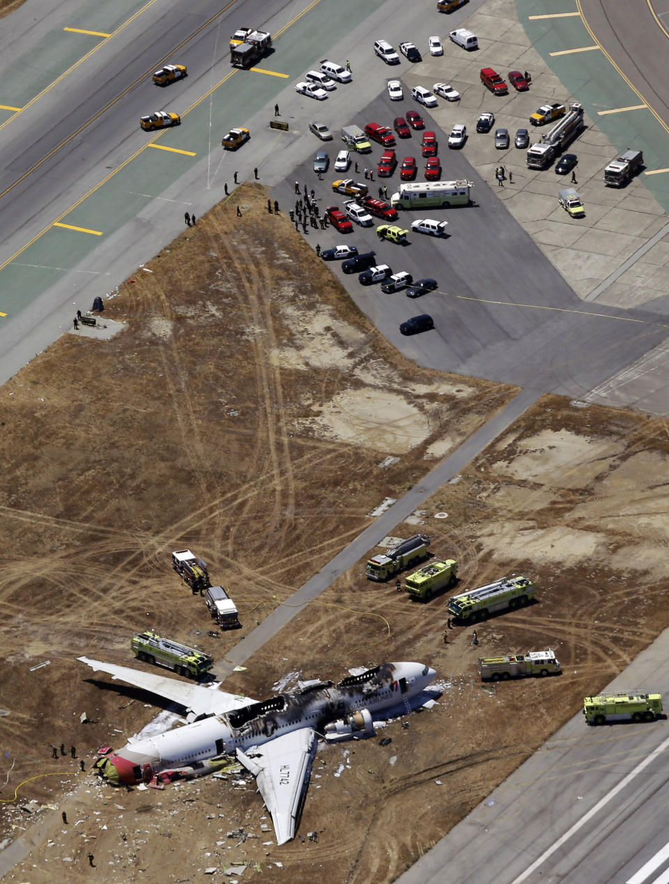 This aerial photo shows the wreckage of the Asiana Flight 214 airplane after it crashed at the San Francisco International Airport in San Francisco, Saturday, July 6, 2013. (AP Photo/Marcio Jose Sanchez)