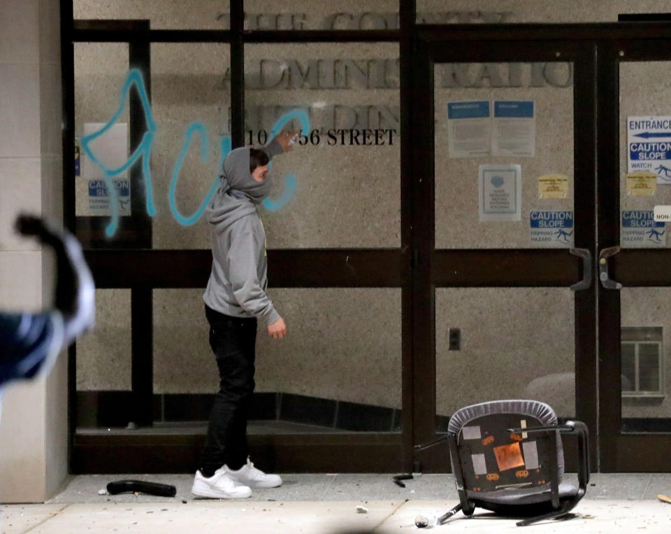 Aug 23, 2020; Kenosha, WI, USA; A window is spray painted at the Kenosha County Administration building next to the Kenosha County courthouse in Kenosha on Sunday. Mandatory Credit: Mike De Sisti/Milwaukee Journal Sentinel via USA TODAY NETWORK/Sipa USA