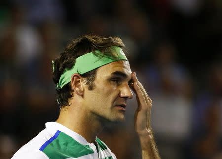 Switzerland's Roger Federer reacts during his semi-final match against Serbia's Novak Djokovic at the Australian Open tennis tournament at Melbourne Park, Australia, January 28, 2016. REUTERS/Thomas Peter