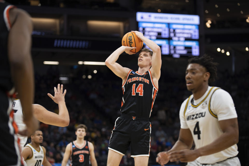 Princeton guard Matt Allocco (14) shoots as Missouri guard DeAndre Gholston (4) waits for a rebound during the first half of a second-round college basketball game in the men's NCAA Tournament, Saturday, March 18, 2023, in Sacramento, Calif. (AP Photo/José Luis Villegas)