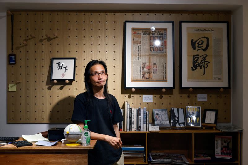 Freelance video producer Sum Wan Wah poses at his bookstore "Have a Nice Stay" after an interview with Reuters, in Hong Kong
