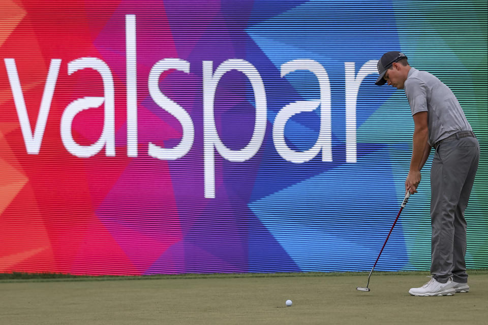 Adam Schenk sinks a birdie putt on the 18th hole during the third round of the Valspar Championship golf tournament Saturday, March 18, 2023, at Innisbrook in Palm Harbor, Fla. (AP Photo/Mike Carlson)