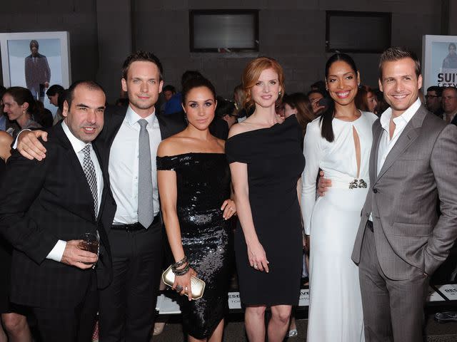 <p>Jamie McCarthy/Getty</p> Rick Hoffman, Patrick J. Adams, Meghan Markle, Sarah Rafferty, Gina Torres and Gabriel Macht attend an event in 2012