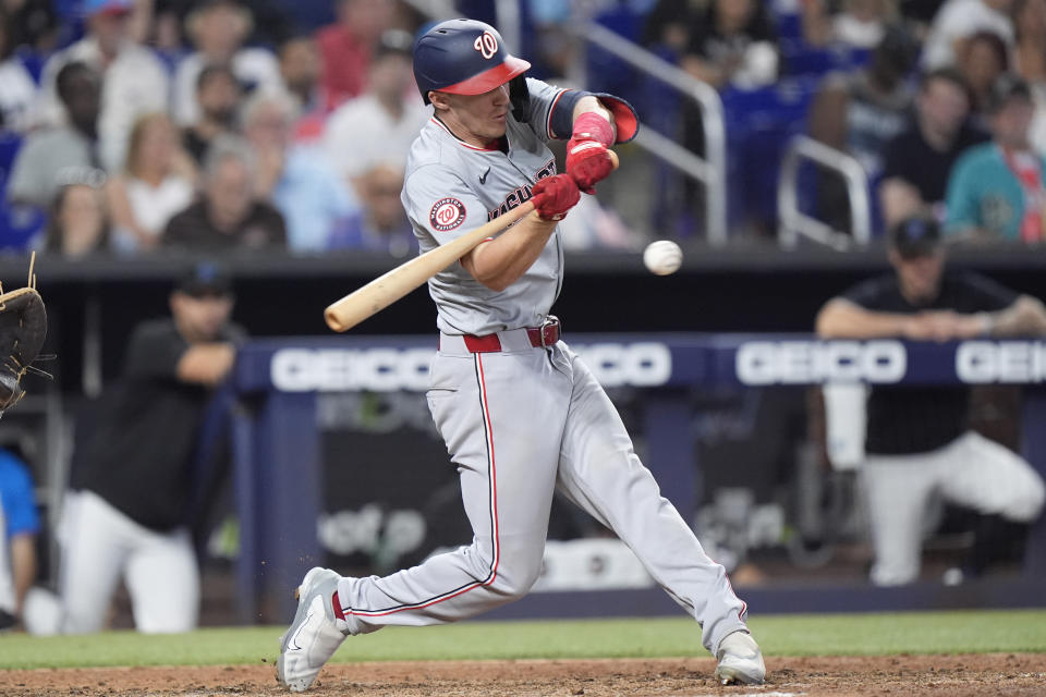 Washington Nationals' Jacob Young hits a single scoring Trey Lipscomb during the fifth inning of a baseball game against the Miami Marlins, Sunday, April 28, 2024, in Miami. (AP Photo/Wilfredo Lee)