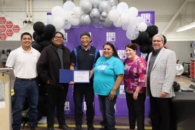 Native American student Carl Cuthair (third from left) of San Juan College in Farmington, New Mexico, is a recipient of one of three Mopar Career Automotive Program (CAP) scholarships. Shown in a recent ceremonial event, Cuthair will receive up to $20,000 reimbursements for necessary tools and two years of tuition to become an automotive service technician. Shown from left to right: Jacob Belin, Engineer and Indigenous Cultural Opportunity Network (ICON) member at Stellantis; Angelo Hatch (son of Cuthair); Carl Cuthair; Rene Cuthair (wife of Carl Cuthair); Kelly Faley, Stellantis, Mopar CAP representative; Tony Lambiase, Stellantis Technical Training representative