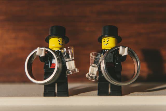 <p>Courtesy of The LEGO Group</p> Grooms create LEGO souvenirs for their guests