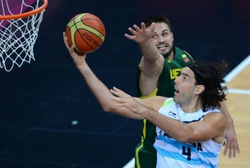 Argentinian forward Luis Scola (R) shoots during the Men's Preliminary Round Group A basketball match Argentina vs Lithuania at the London 2012 Olympic Games. Scola scored 32 points and Manu Ginobili added 21 to lead Argentina's victory over Lithuania. They are among five players on the South American squad who won 2004 Olympic gold