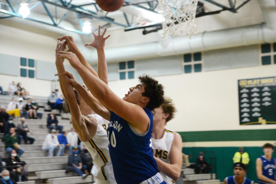 Ben Przytula of Gibraltar Carlson battles for a rebound against Flat Rock during a 40-37 Carlson win Tuesday night.