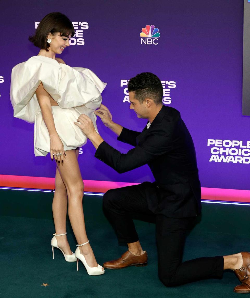 Sarah Hyland and Wells Adams attend the 47th Annual People's Choice Awards at Barker Hangar on December 07, 2021 in Santa Monica, California
