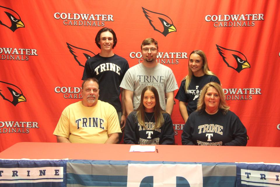 Coldwater's McKenna Hantz, surrounded by family and friends, signed her letter of intent to compete at Trine University