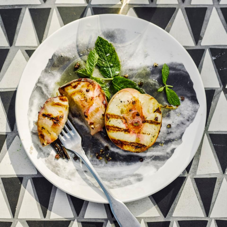 Grilled white peaches with Sichuan pepper and mint - Credit: Haarala Hamilton & Valerie Berry