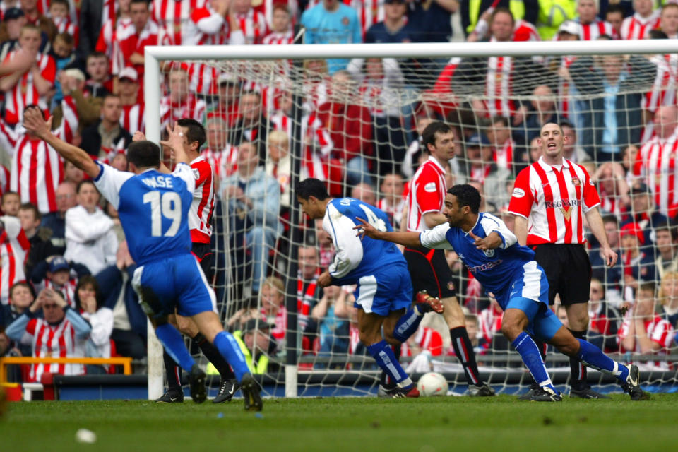 Tim Cahill wheels away after scoring the only goal of the 2004 FA Cup semi-final