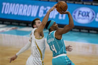 Dallas Mavericks guard Luka Doncic blocks a shot by Charlotte Hornets guard Devonte' Graham during the first half of an NBA basketball game in Charlotte, N.C., Wednesday, Jan. 13, 2021. (AP Photo/Chris Carlson)