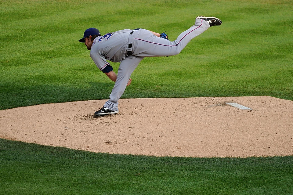 DETROIT, MI - OCTOBER 13: C.J. Wilson #36 of the Texas Rangers throws a pitch against the Detroit Tigers in Game Five of the American League Championship Series at Comerica Park on October 13, 2011 in Detroit, Michigan. (Photo by Kevork Djansezian/Getty Images)