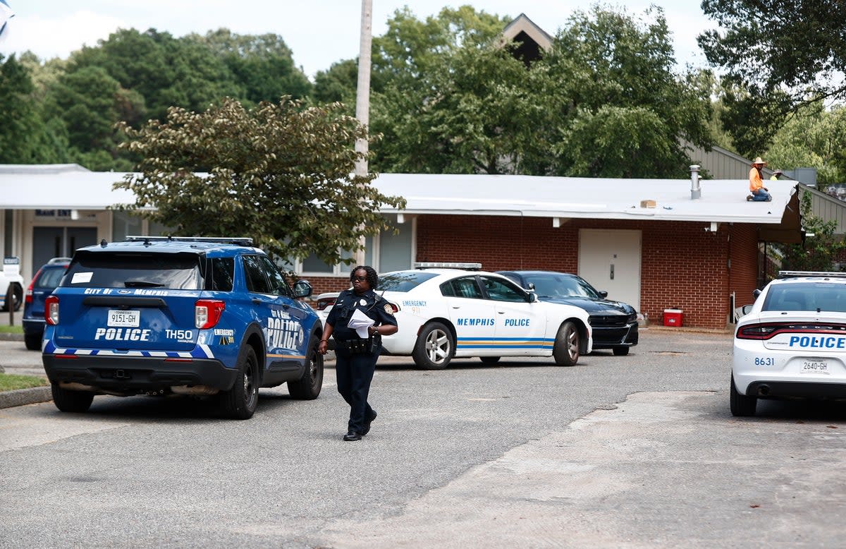 A Memphis Police officer walks on the scene of a shooting at Margolin Hebrew School on Monday, July 31, 2023 in Memphis, Tenn.  ((Mark Weber/Daily Memphian via AP))