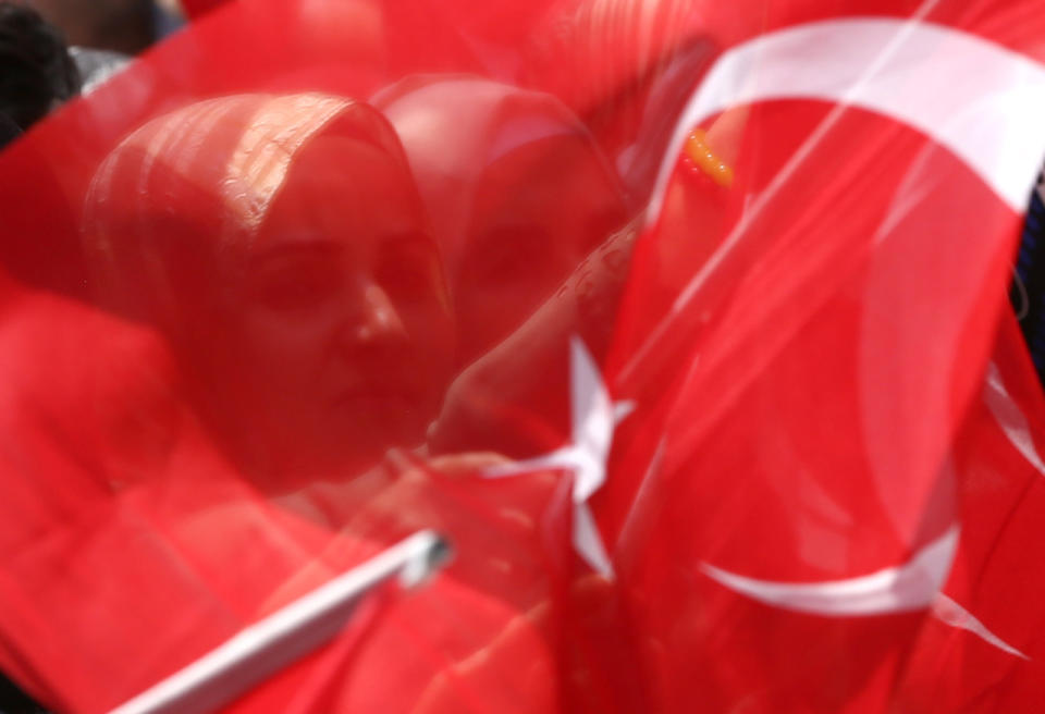 Draped under national flag 