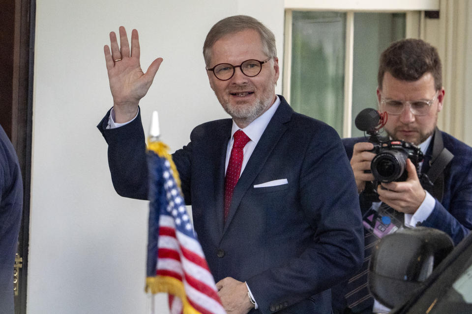 Czech Republic's Prime Minister Petr Fiala waves as he arrives for a meeting with President Joe Biden in the Oval Office of the White House, Monday, April 15, 2024, in Washington. (AP Photo/Alex Brandon)