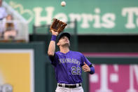 Colorado Rockies left fielder Sam Hilliard prepares to catch a fly ball hit by Washington Nationals' Cesar Hernandez during the third inning of the second baseball game of a doubleheader Saturday, May 28, 2022, in Washington. (AP Photo/Nick Wass)