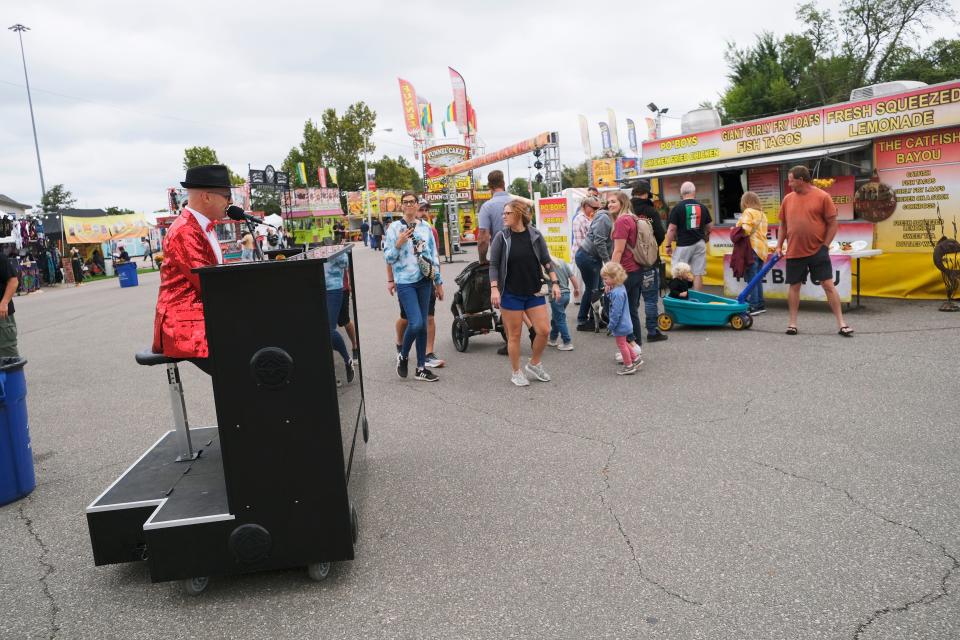 Ed Kelly, who hails from Canada, performs as the Rock n Rolling Piano during the first day of the Oklahoma State Fair Thursday, Sept. 14, 2023.