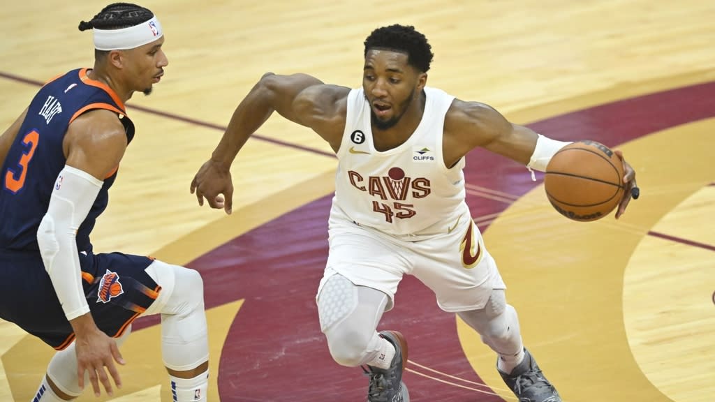 Apr 15, 2023; Cleveland, Ohio, USA; Cleveland Cavaliers guard Donovan Mitchell (45) dribbles beside New York Knicks guard Josh Hart (3) in the second quarter of game one of the 2023 NBA playoffs at Rocket Mortgage FieldHouse.