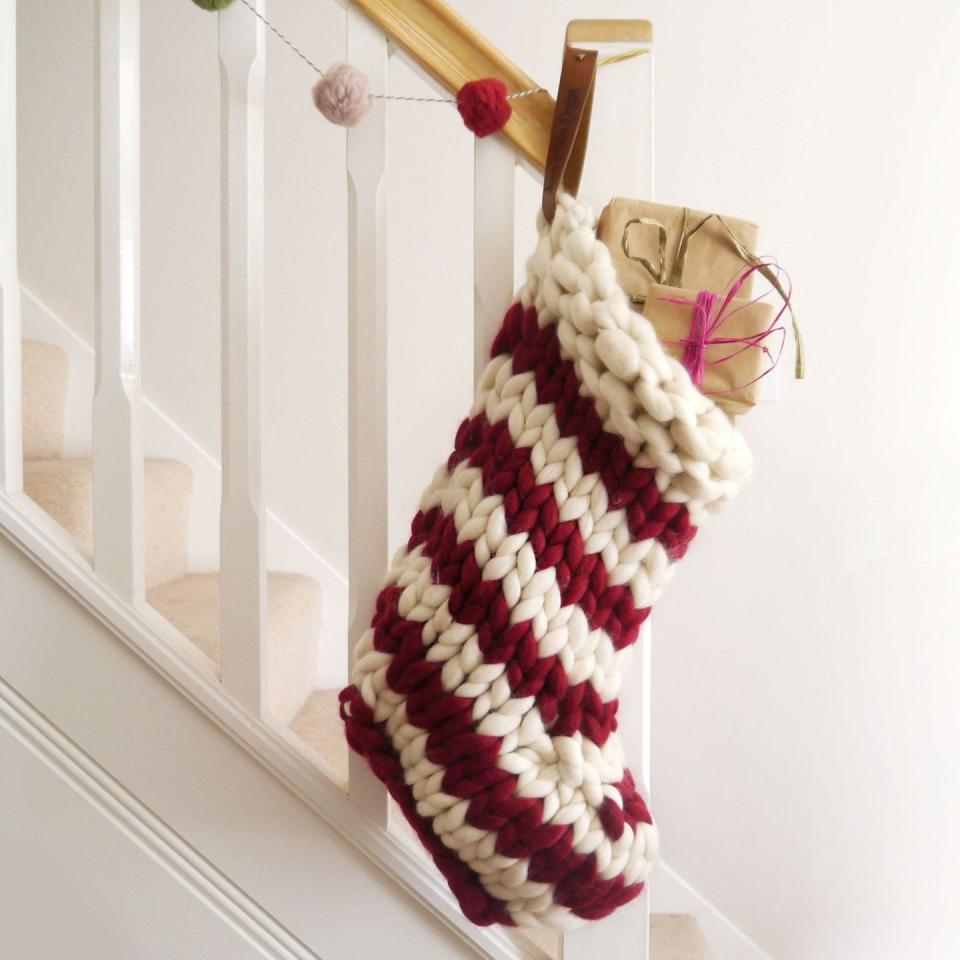 <p>Aside from making them yourself (depending on the level of difficulty), if buying new decorations for the home, choose handmade using wool, wood, rattan, recycled glass, hemp, jute etc.</p><p>If not on your local high street, you'll also find that many online shops sell locally made, bespoke goods too, so have a browse – you never know what you might find. For crafts, take a look at <a href="https://go.redirectingat.com?id=127X1599956&url=https%3A%2F%2Fwww.etsy.com%2Fuk%2F%3Fref%3Dlgo&sref=https%3A%2F%2Fwww.housebeautiful.com%2Fuk%2Flifestyle%2Fshopping%2Fg25616166%2Fsustainable-christmas%2F" rel="nofollow noopener" target="_blank" data-ylk="slk:Etsy;elm:context_link;itc:0;sec:content-canvas" class="link ">Etsy</a>, <a href="https://www.amazon.co.uk/b?ie=UTF8&node=9699254031&tag=hearstuk-yahoo-21&ascsubtag=%5Bartid%7C2060.g.25616166%5Bsrc%7Cyahoo-uk" rel="nofollow noopener" target="_blank" data-ylk="slk:Amazon Handmade;elm:context_link;itc:0;sec:content-canvas" class="link ">Amazon Handmade</a> and <a href="https://go.redirectingat.com?id=127X1599956&url=https%3A%2F%2Fwww.notonthehighstreet.com%2F&sref=https%3A%2F%2Fwww.housebeautiful.com%2Fuk%2Flifestyle%2Fshopping%2Fg25616166%2Fsustainable-christmas%2F" rel="nofollow noopener" target="_blank" data-ylk="slk:Notonthehighstreet.com;elm:context_link;itc:0;sec:content-canvas" class="link ">Notonthehighstreet.com</a>. It's also worth browsing <a href="https://go.redirectingat.com?id=127X1599956&url=https%3A%2F%2Fwww.nkuku.com%2F&sref=https%3A%2F%2Fwww.housebeautiful.com%2Fuk%2Flifestyle%2Fshopping%2Fg25616166%2Fsustainable-christmas%2F" rel="nofollow noopener" target="_blank" data-ylk="slk:Nkuku;elm:context_link;itc:0;sec:content-canvas" class="link ">Nkuku</a> for Christmas decorations and homewares – everything is ethical, eco-friendly and handmade.</p><p>'Spruce up your home and tree with ornaments made from natural biodegradable materials,' says Etsy Trend Expert, Dayna Isom Johnson. 'There’s nothing better than a beautifully made heirloom Christmas decoration that will be in your family forever and stands out in the living room.'</p><p>Shop this <a href="https://go.redirectingat.com?id=127X1599956&url=https%3A%2F%2Fwww.etsy.com%2Fuk%2Flisting%2F493194193%2Fchunky-knit-striped-christmas-stocking&sref=https%3A%2F%2Fwww.housebeautiful.com%2Fuk%2Flifestyle%2Fshopping%2Fg25616166%2Fsustainable-christmas%2F" rel="nofollow noopener" target="_blank" data-ylk="slk:Chunky Knit Striped Christmas Stocking from Lauren Aston Designs on Etsy;elm:context_link;itc:0;sec:content-canvas" class="link ">Chunky Knit Striped Christmas Stocking from Lauren Aston Designs on Etsy</a>.</p>