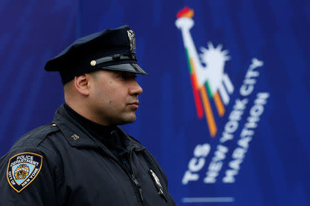 A New York City Police (NYPD) officer stands by at the finish line of the New York City Marathon in Central Park in New York, U.S. November 5, 2017. REUTERS/Brendan McDermid