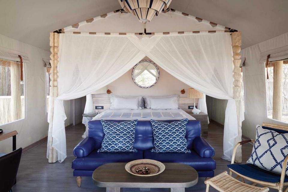 A blue and white guest room at Belmond Savute Elephant Lodge, voted one of the best Africa Safari Lodges