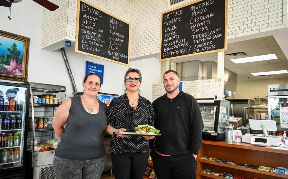 Leia Perez, from left, owner Faviola Avelar and Kinley Gee work together as a team to get the word on out on their homestyle sandwiches, coffee and baked goods at Downtown Oak in downtown Fresno.