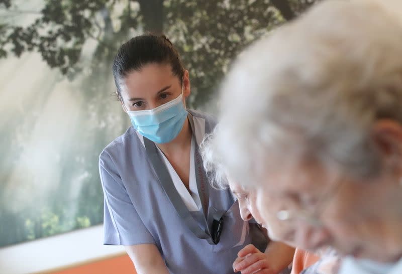 Employees at the house for elderly Residence Christalain take care of residents during the coronavirus disease (COVID-19) outbreak, in Brussels