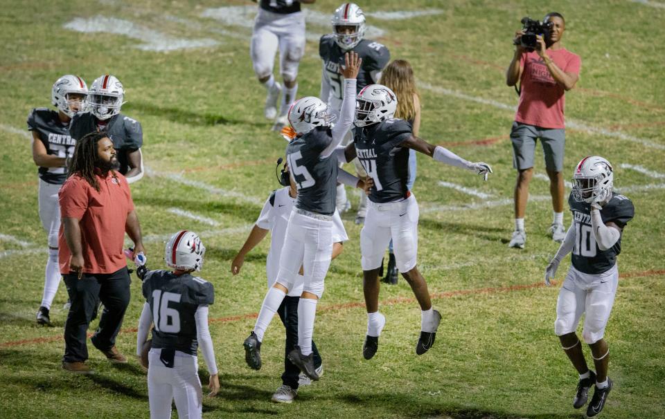 Palm Beach Central's Tony Williams, 14, celebrates with Caleb Butler  during game against Wellington on October 28, 2022.