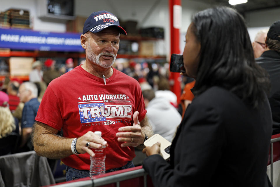 A supporter is interviewed before former President Donald Trump speaks in Clinton Township, Mich., Wednesday, Sept. 27, 2023. Trump will be in battleground Michigan working to win over blue-collar voters in the midst of an autoworkers’ strike. Trump's trip on Wednesday comes as his Republican challengers gather onstage in California for their second primary debate. (AP Photo/Mike Mulholland)