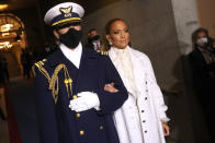 WASHINGTON, DC - JANUARY 20: Jennifer Lopez is escorted to the inauguration of U.S. President-elect Joe Biden on the West Front of the U.S. Capitol on January 20, 2021 in Washington, DC. During today's inauguration ceremony Joe Biden becomes the 46th president of the United States. (Photo by Win McNamee/Getty Images)