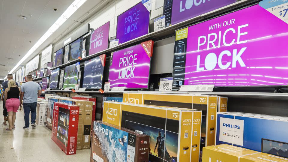 Wide screen flat digital TVs on display at a Walmart store in Miami, Florida, on March 29, 2023. - Jeffrey Greenberg/Universal Images Group/Getty Images)