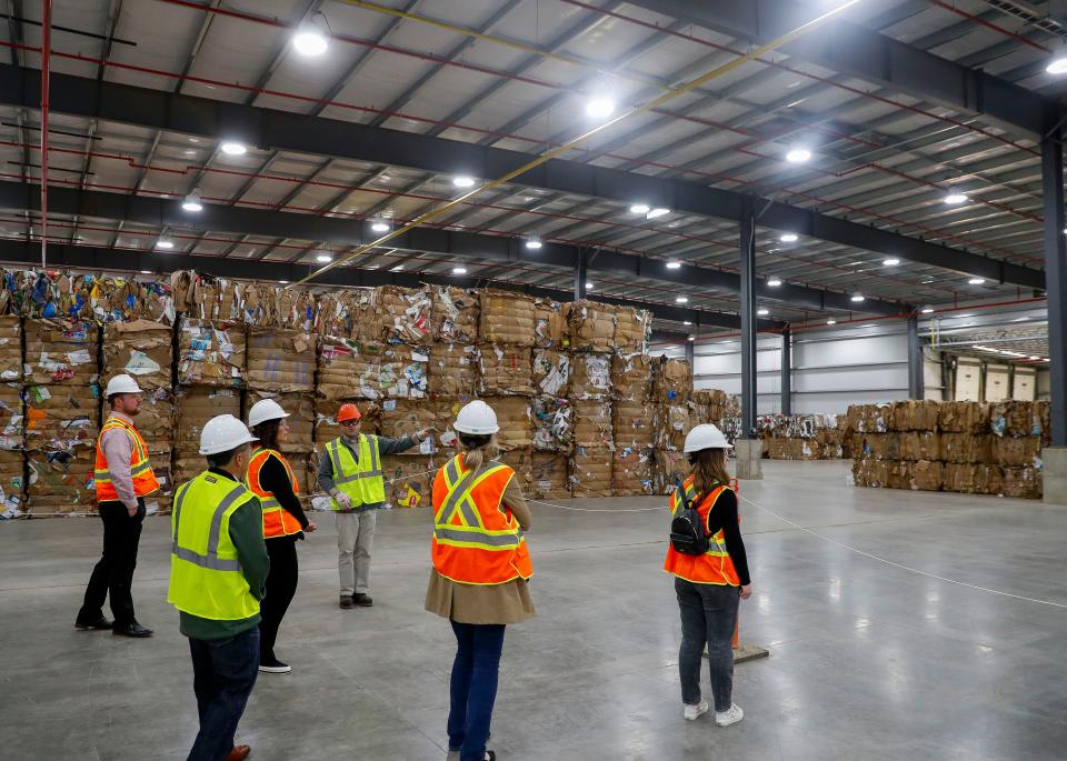 ND Paper Biron Division vice president and general manager Caleb Coder points while leading a tour of the new recycling facility on Thursday, May 18, 2023, at the ND Paper mill in Biron, Wis. The new facility gives the Biron mill the ability to process recycled paper material and then use it to produce new paper products.