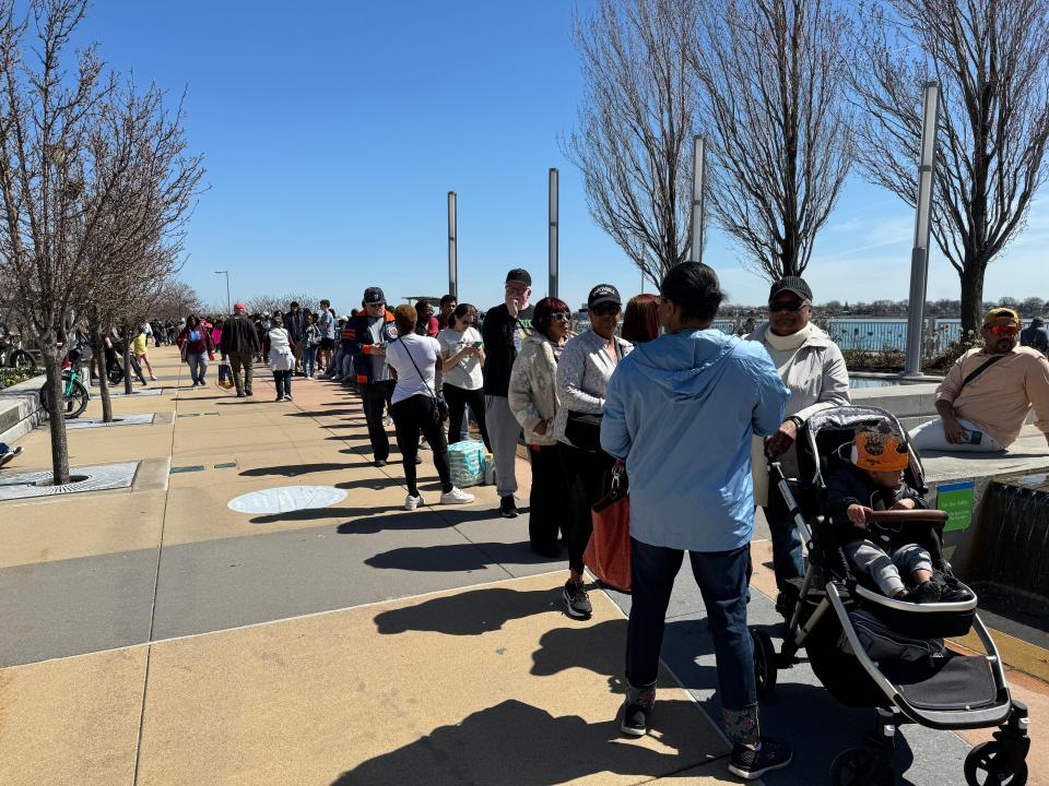 At the RiverWalk in Detroit, hundreds waited in line for eclipse glasses on April 8, 2024.