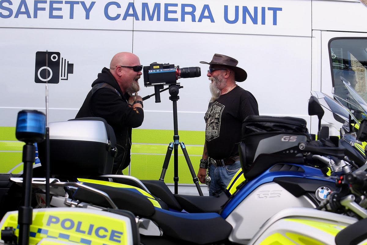 Bikers Chas McLeod, left, and Jock McGaughey from South Queensferry check out the new speed camera to be deployed by Police Scotland motorcycle division in 2016 (stock pic) <i>(Image: NQ/Gordon Terris)</i>